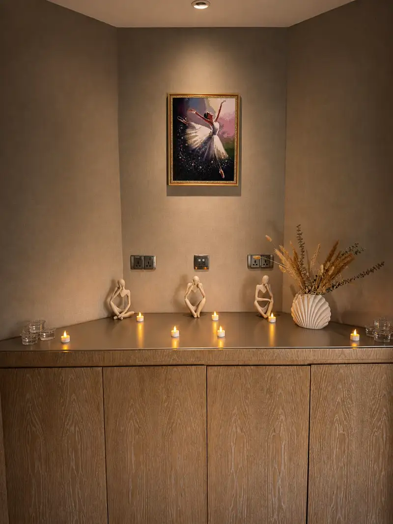 Bella Spa Dubai interior detail with candles and decorative figurines